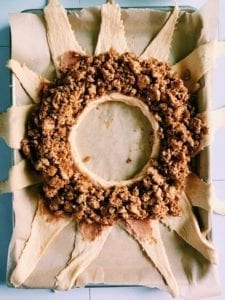 Taco ring with fillings on top before being wrapped