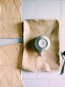 Bowl on parchment paper with crescent roll dough next to it