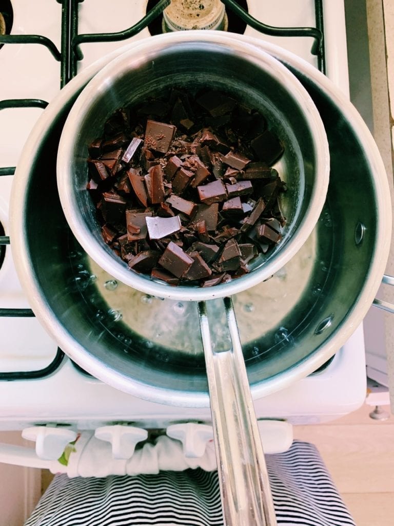 Overhead view of double-boiler with chocolate in it. 