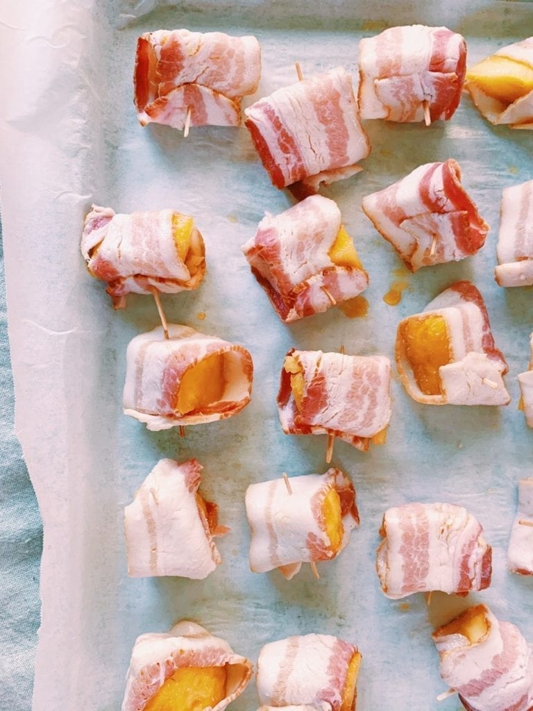 Bacon wrapped pineapple bites before going into the oven