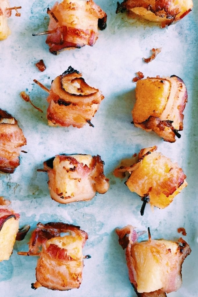 Bacon wrapped pineapple bites that have been cooked