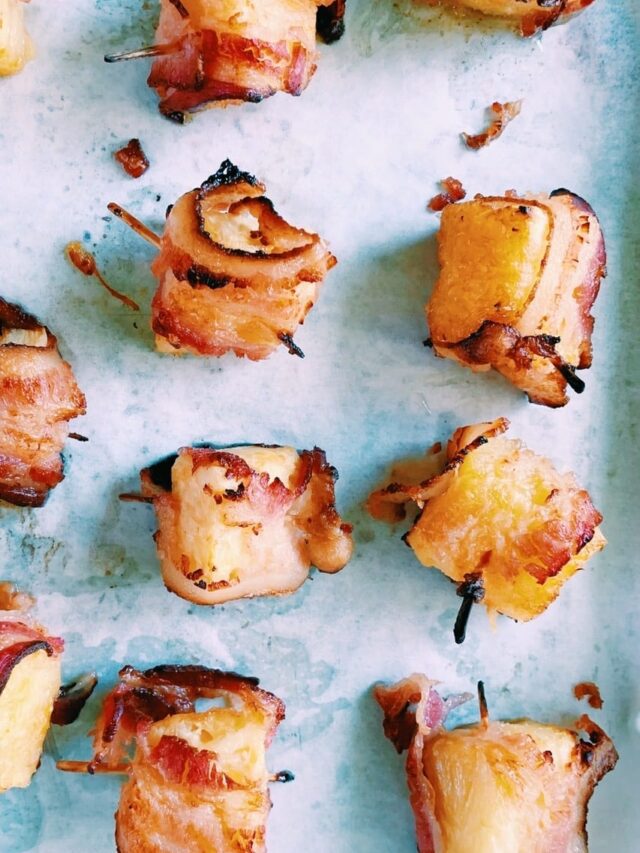 Bacon wrapped pineapple bites that have been cooked