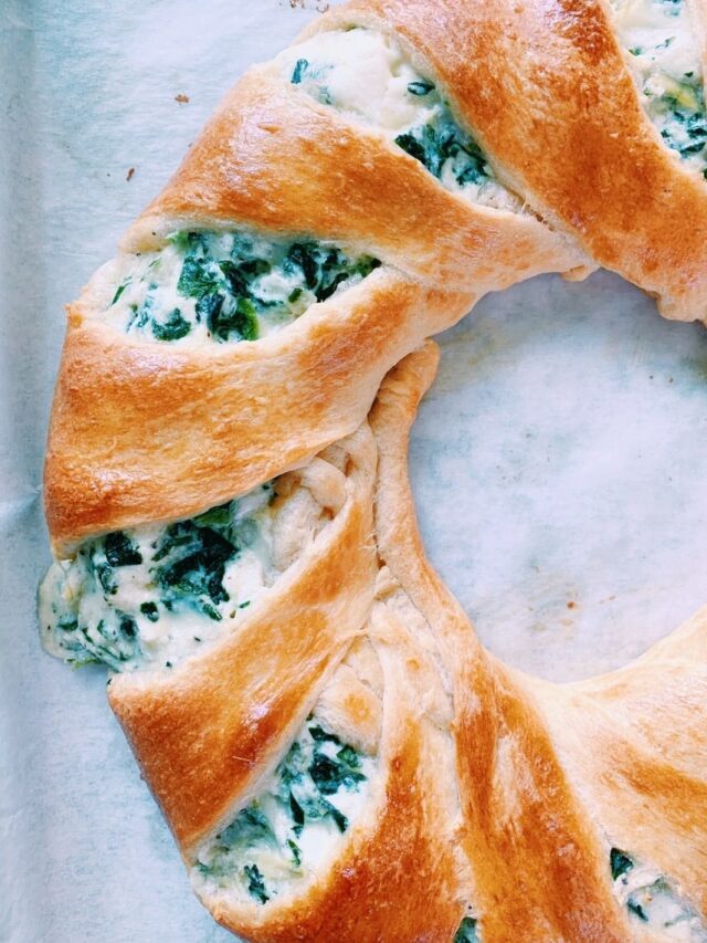 Close up of spinach and artichoke dip crescent ring