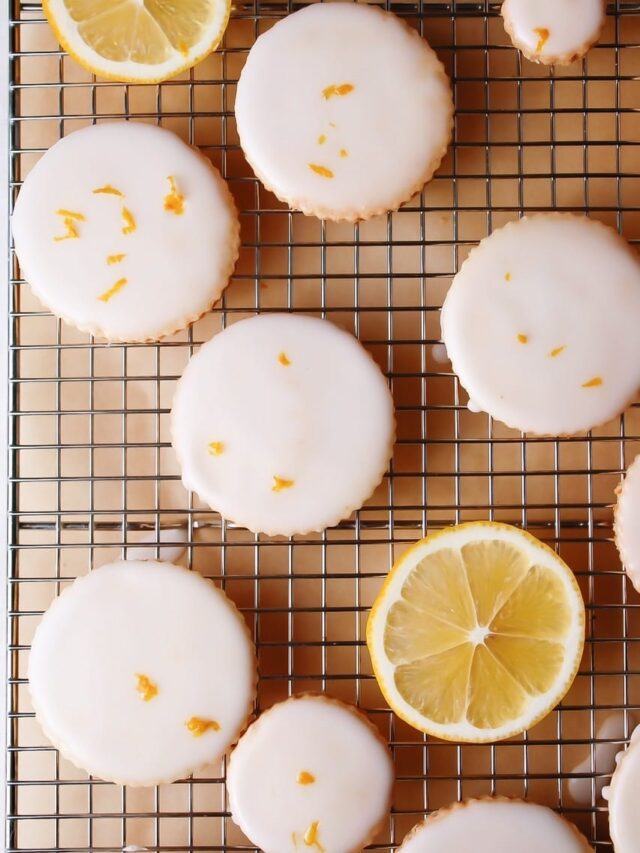 Lemon shortbread cookies with lemon glaze on a cooling rack