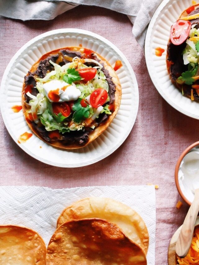 Overhead shot of homemade tostadas with refried black beans