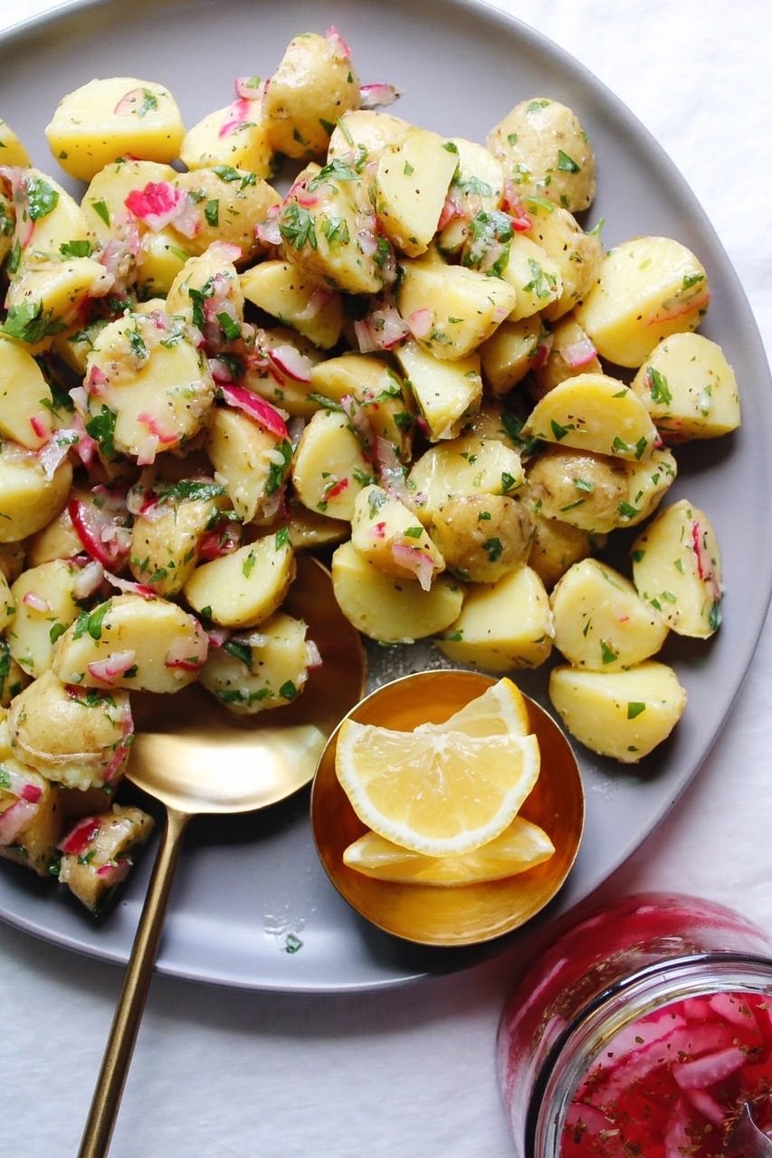 summer potato salad with no mayo on a gray plate