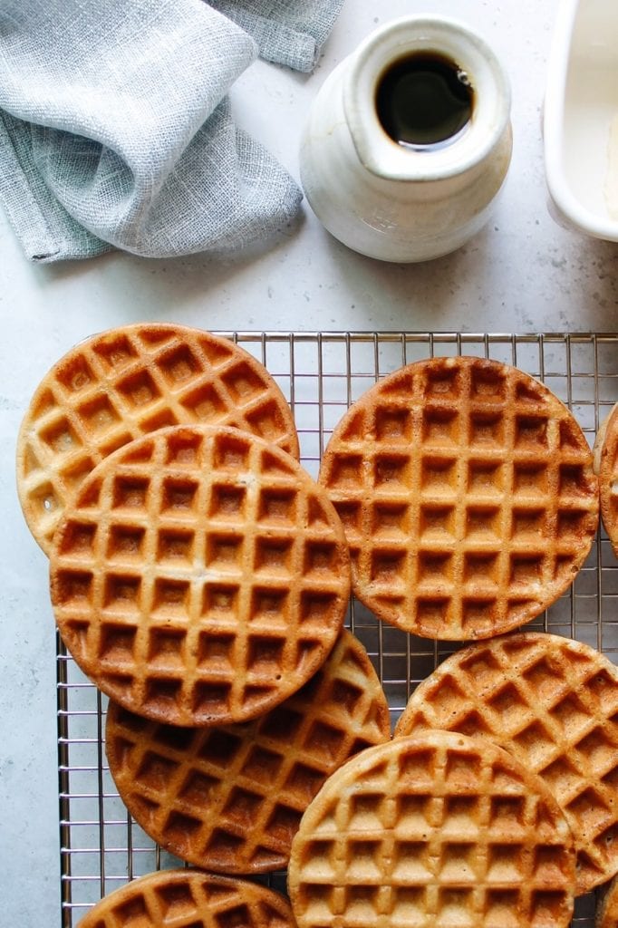 golden brown waffles on a cooling rack