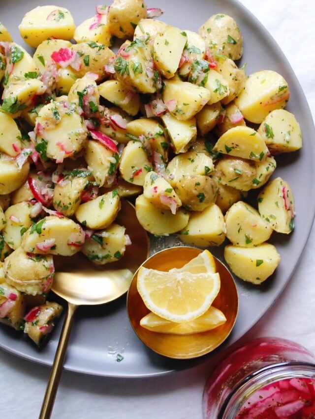 summer potato salad with no mayo on a gray plate