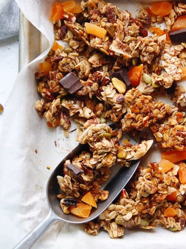 homemade granola on a baking sheet lined with parchment paper