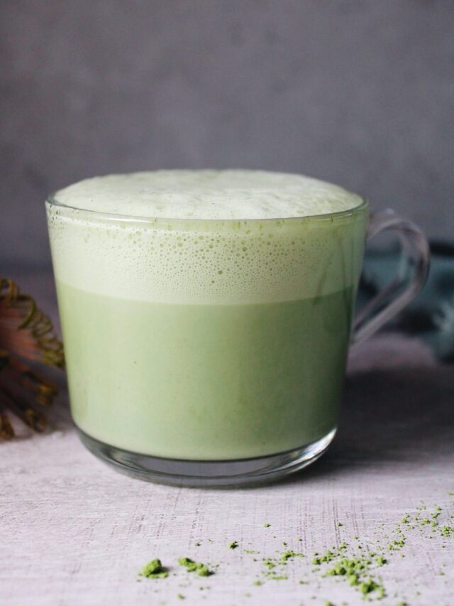 matcha oat milk latte in a glass mug