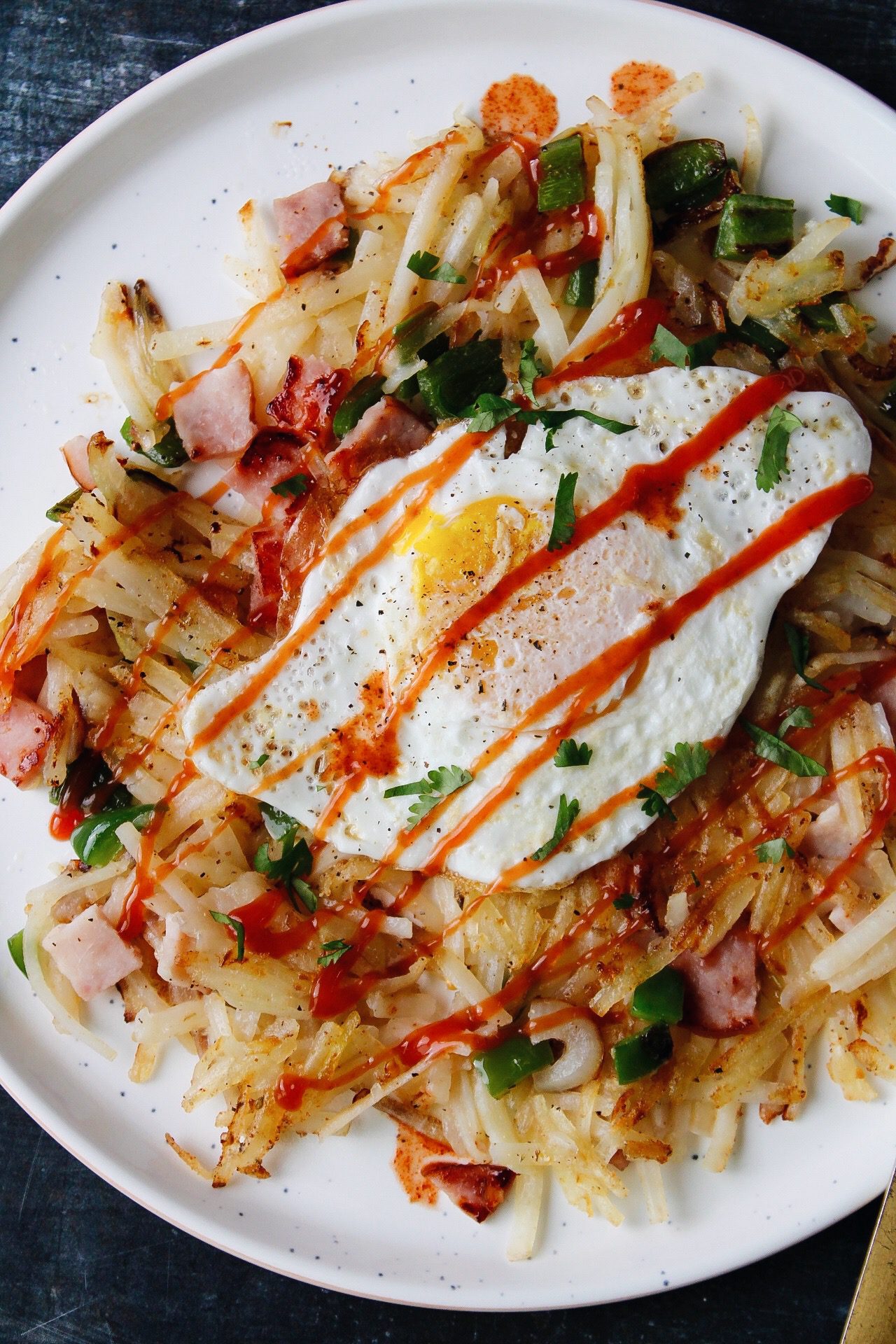 ham and pepper hash topped with an egg