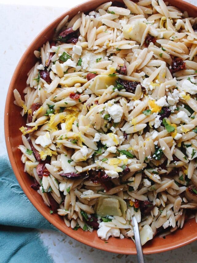 lemon orzo pasta salad in a rust colored bowl