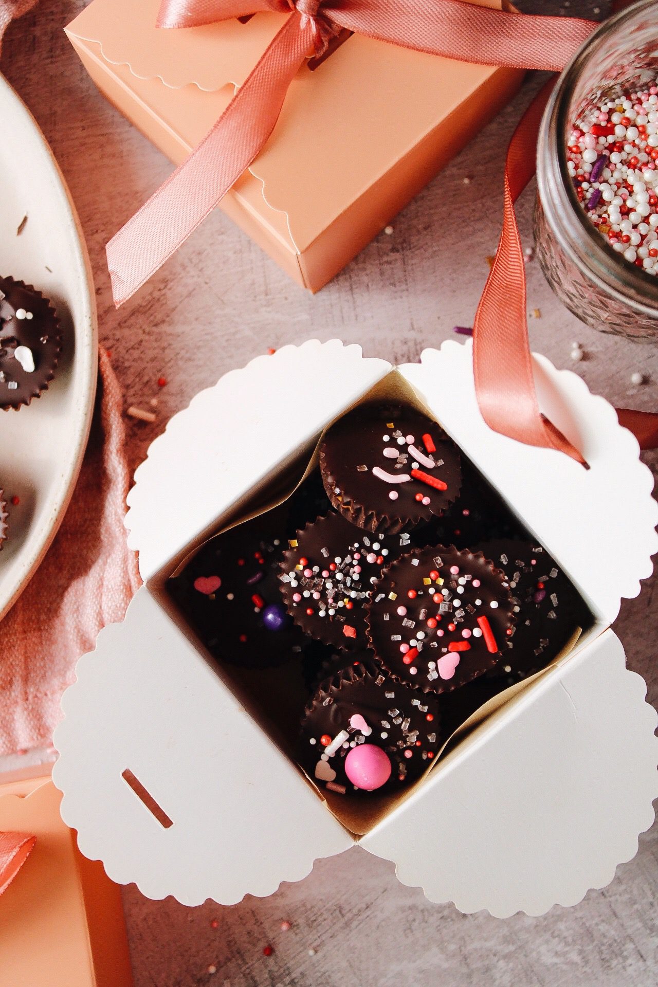 homemade peanut butter cups in a cute pink box for valentines day