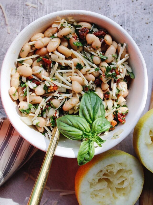 Tuscan White Bean Salad in a Bowl with a Spoon