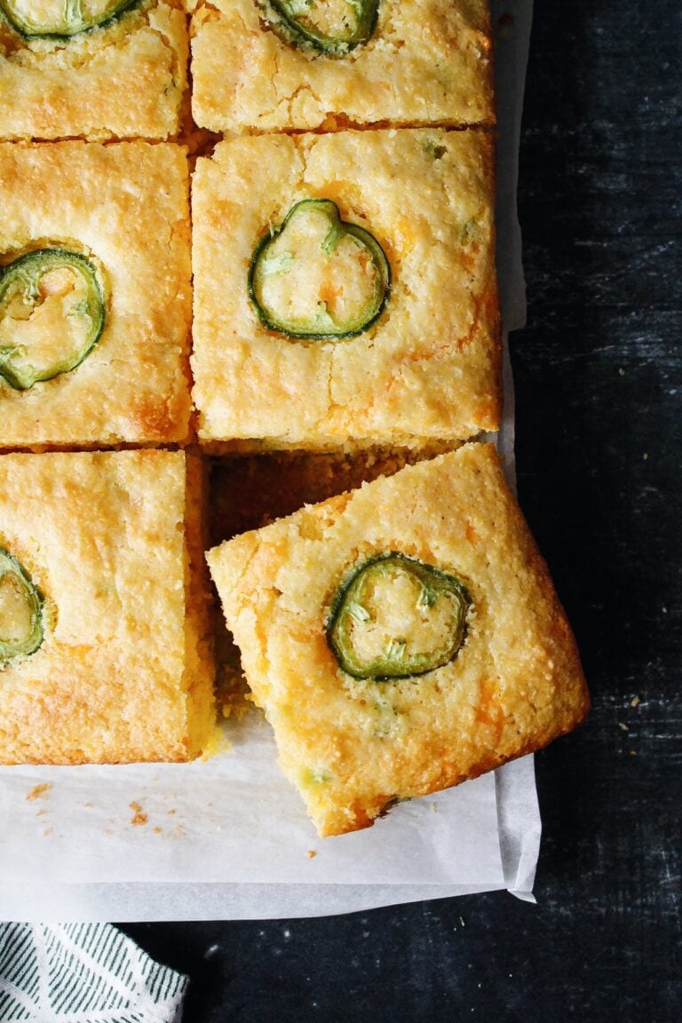 sliced of jiffy jalapeno cornbread on white parchment paper