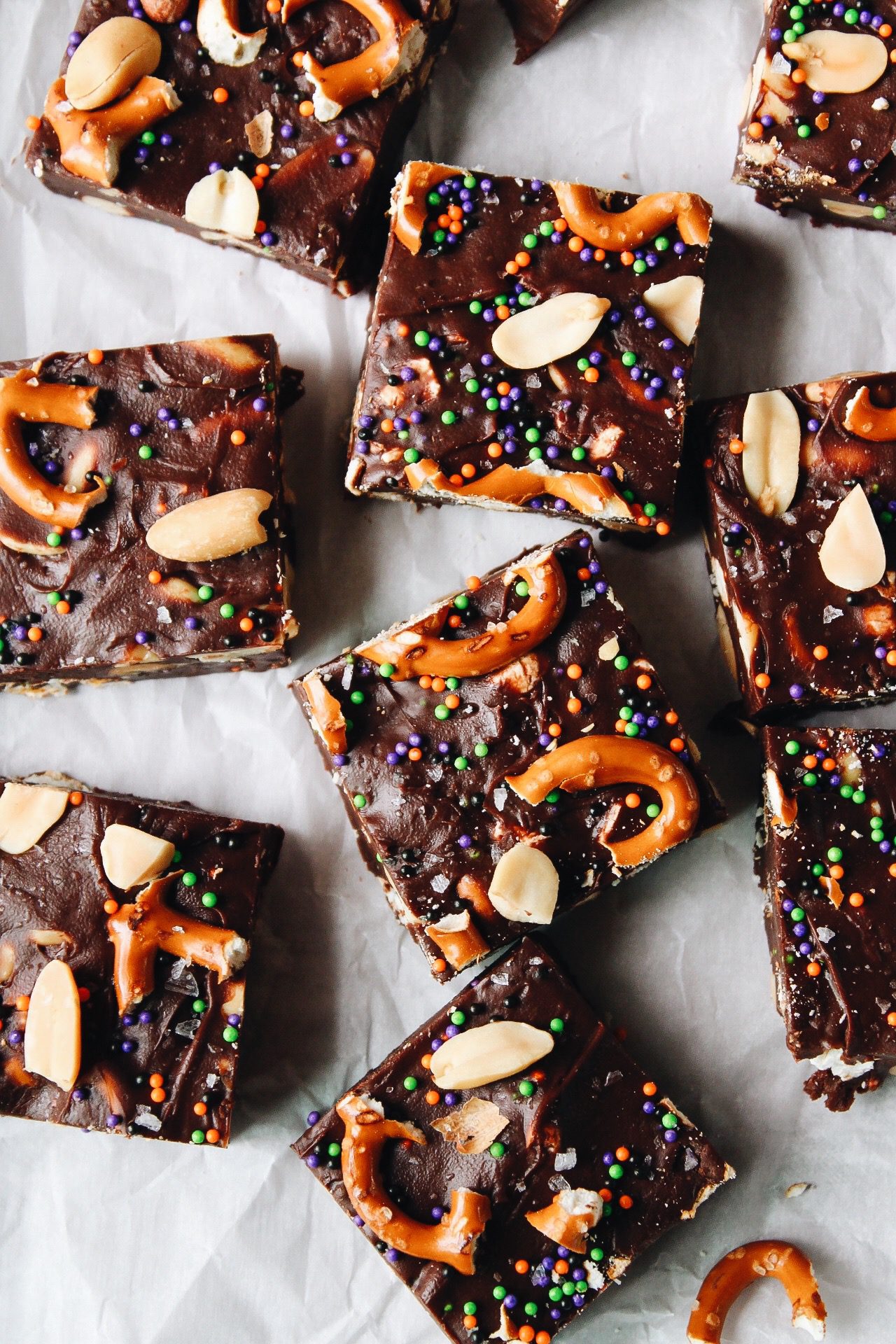 no bake fudge with pretzels, peanuts and popcorn cut into squares