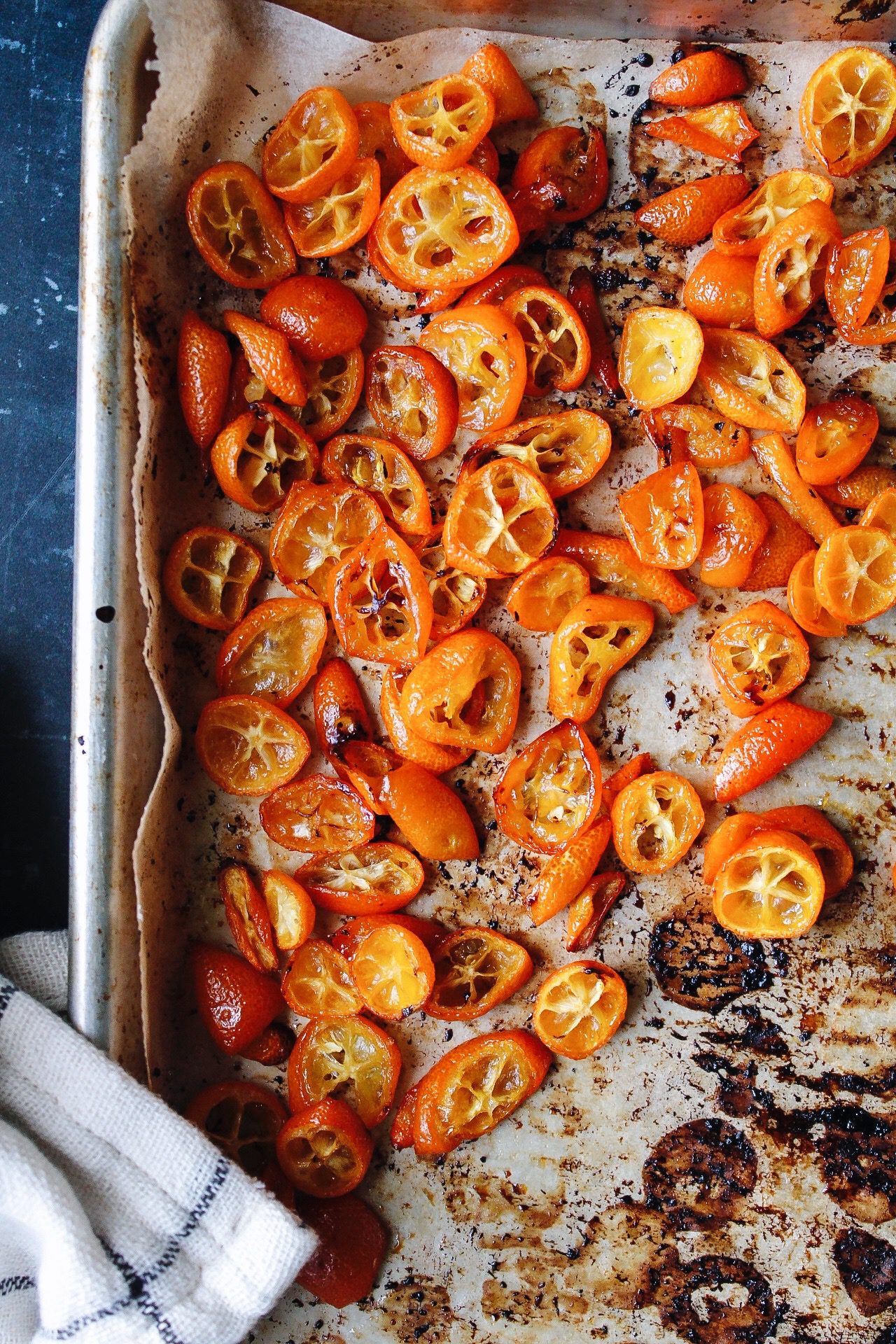 roasted kumquats on a baking sheet