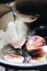 fresh figs, sugar and water in a pot