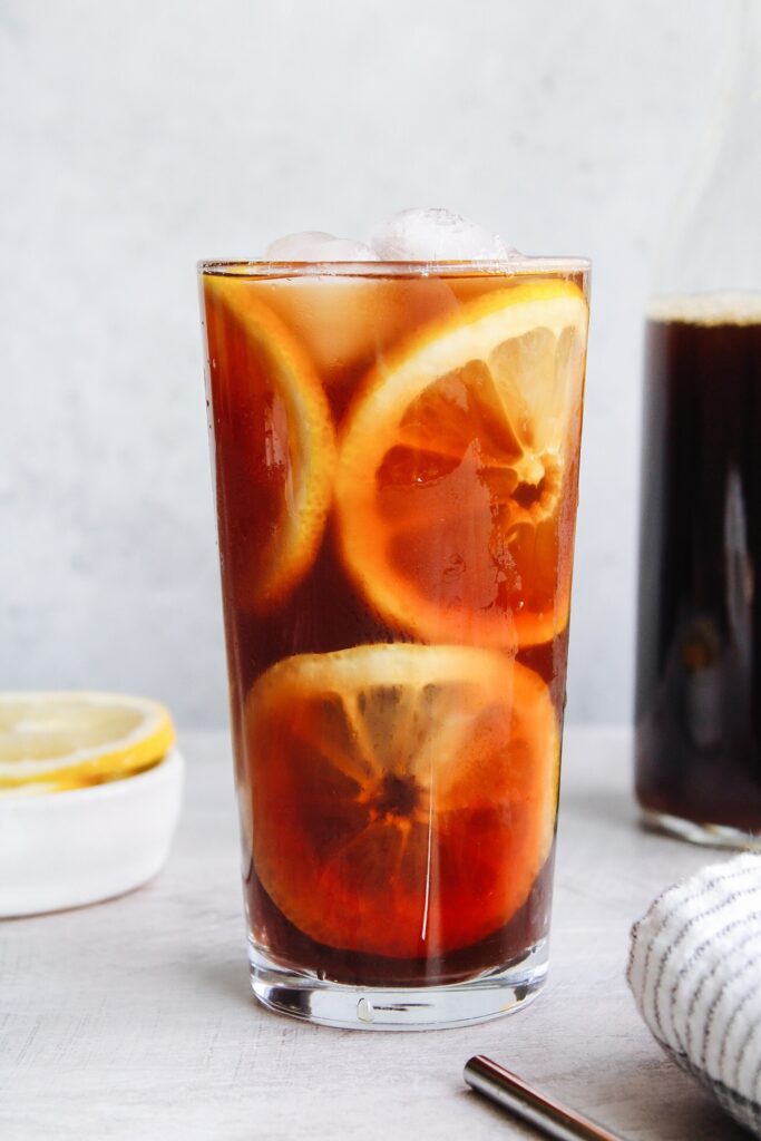 sweet tea in a clear glass with lemon slices