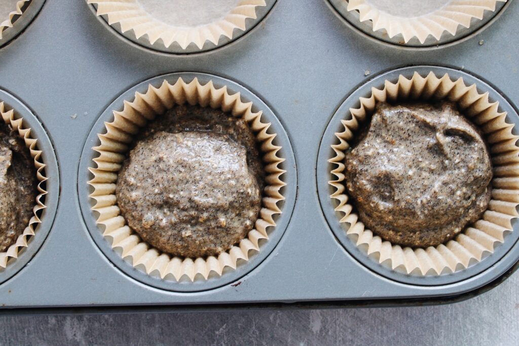 buckwheat pumpkin muffin batter in muffin cups