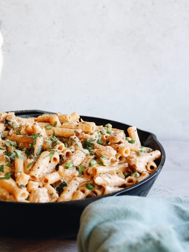 creamy chipotle chicken pasta in a cast iron skillet