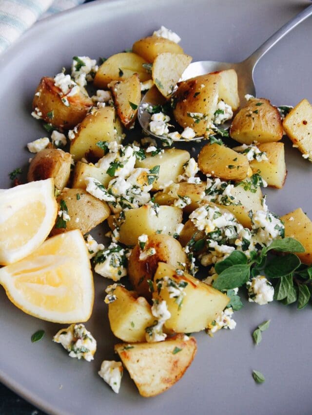 mediterranean potatoes with lemons on a gray plate