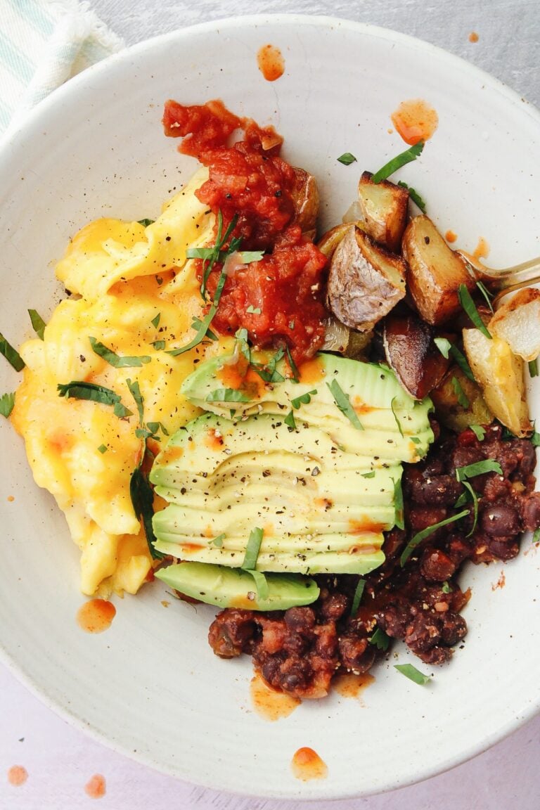 southwest breakfast bowl with black beans, potatoes, eggs, salsa and avocado