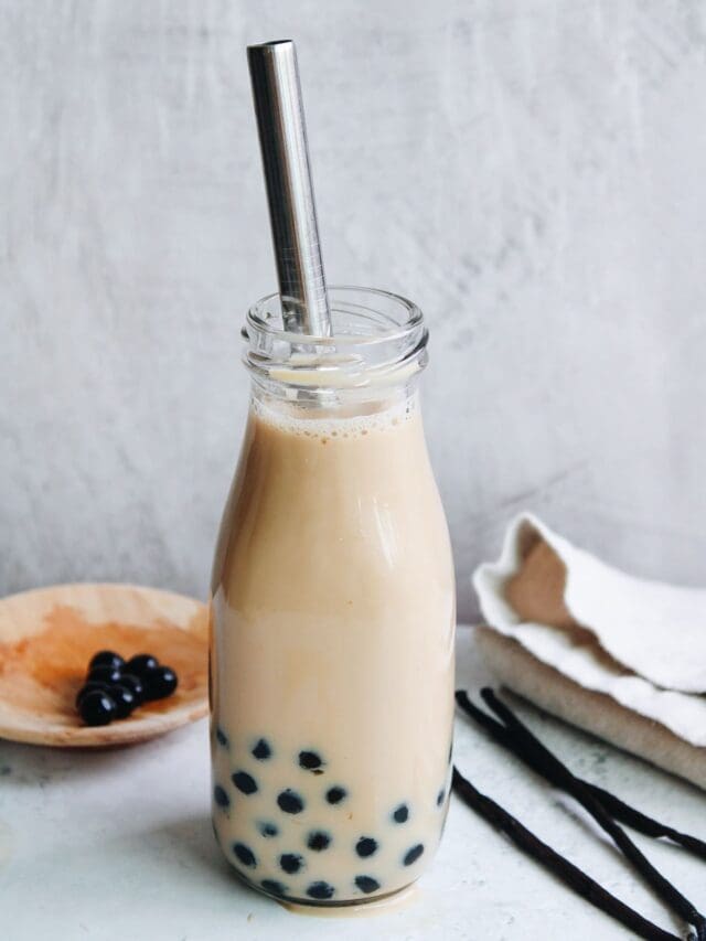 vanilla milk tea in a glass bottle with boba