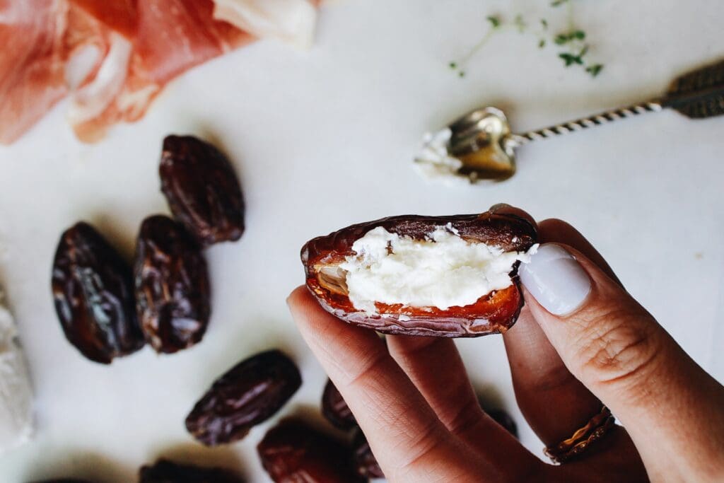 date stuffed with a teaspoon of goat cheese