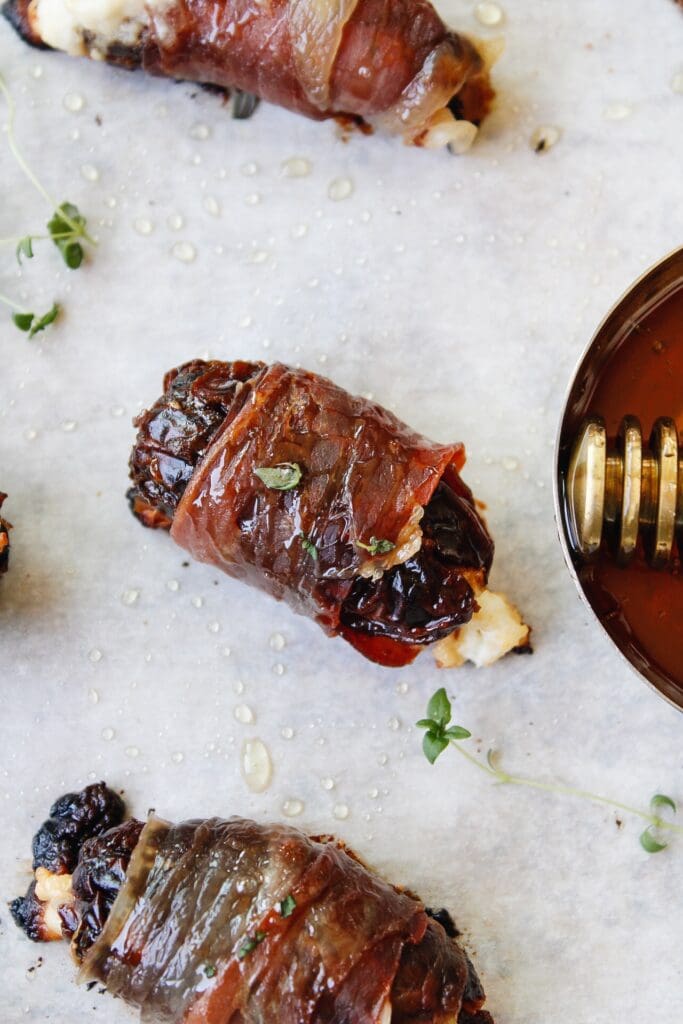 baked prosciutto wrapped date with honey and thyme