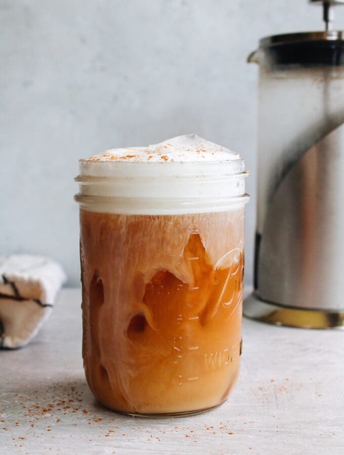 cold brew coffee made in a french press with milk foam on top