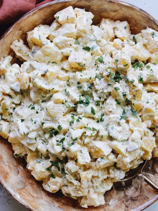 potato salad with pickles in a large bowl