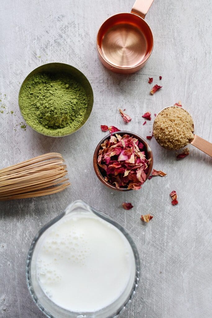 rose matcha latte ingredients on a gray background