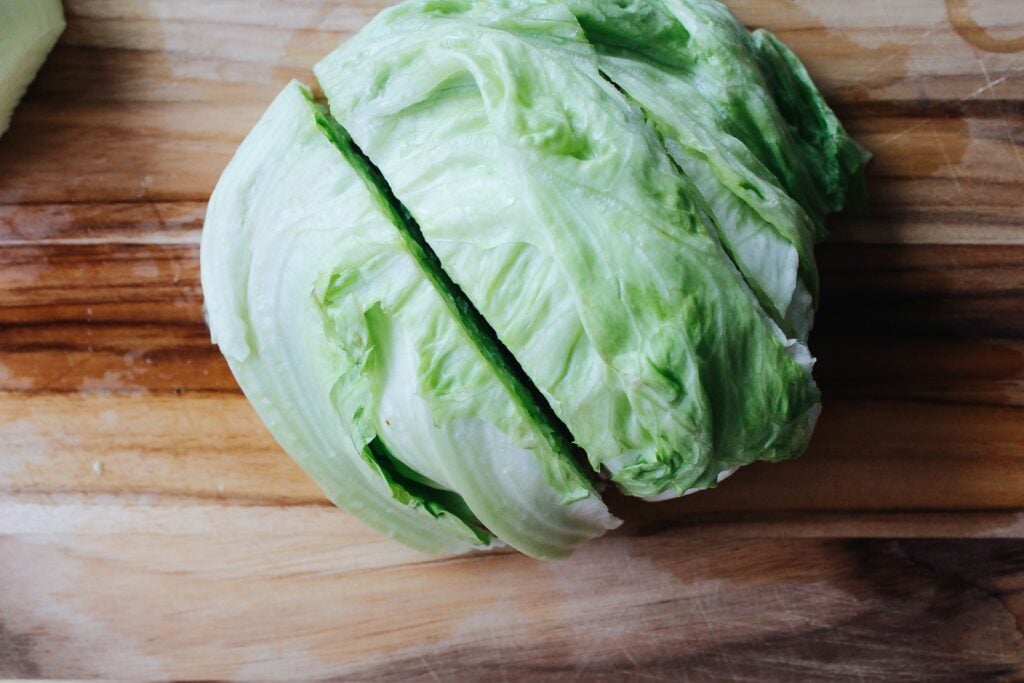 a head of ice berg lettuce cut in half