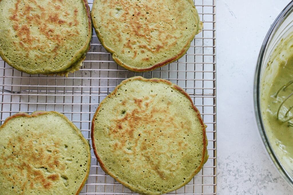 matcha pancakes on a wire cooling rack