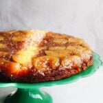 fig and honey cake on a bright green cake stand.