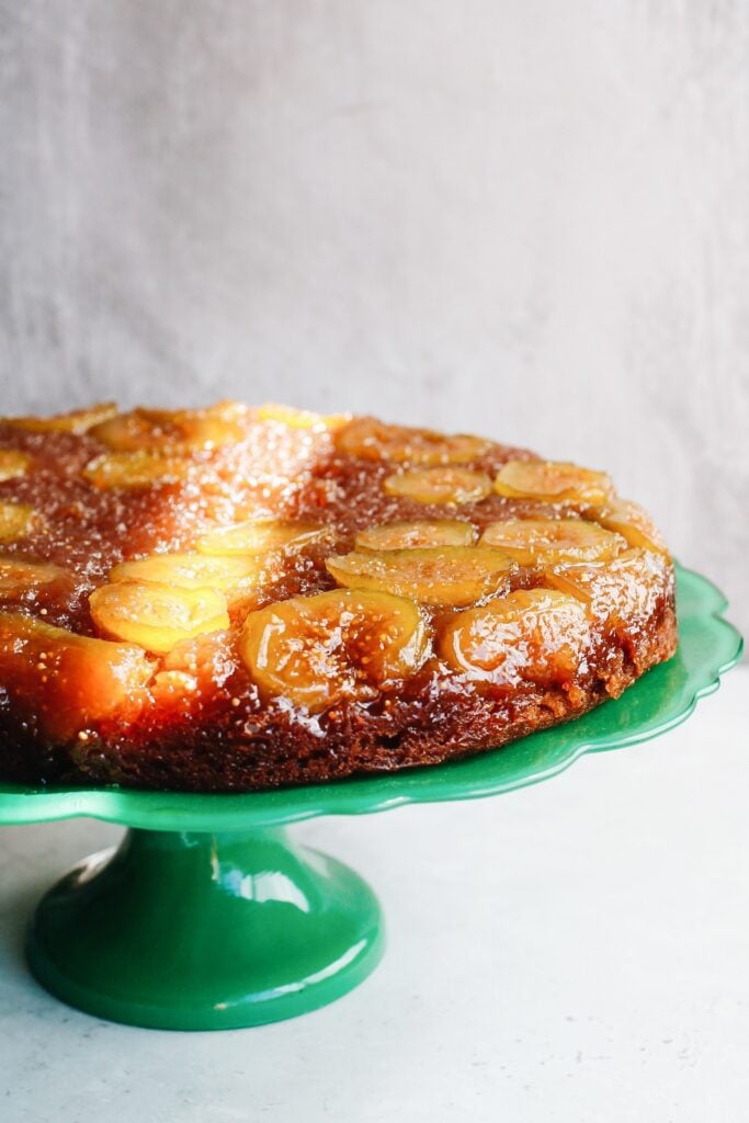 fig and honey cake on a bright green cake stand. 