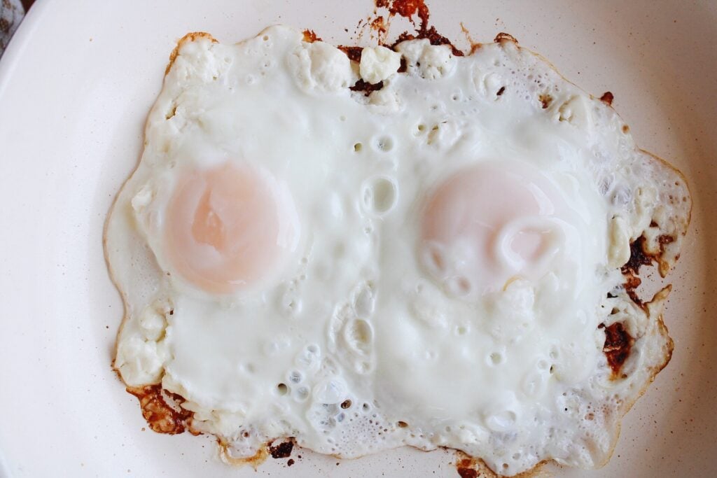 feta fried eggs that have been cooked until whites are set