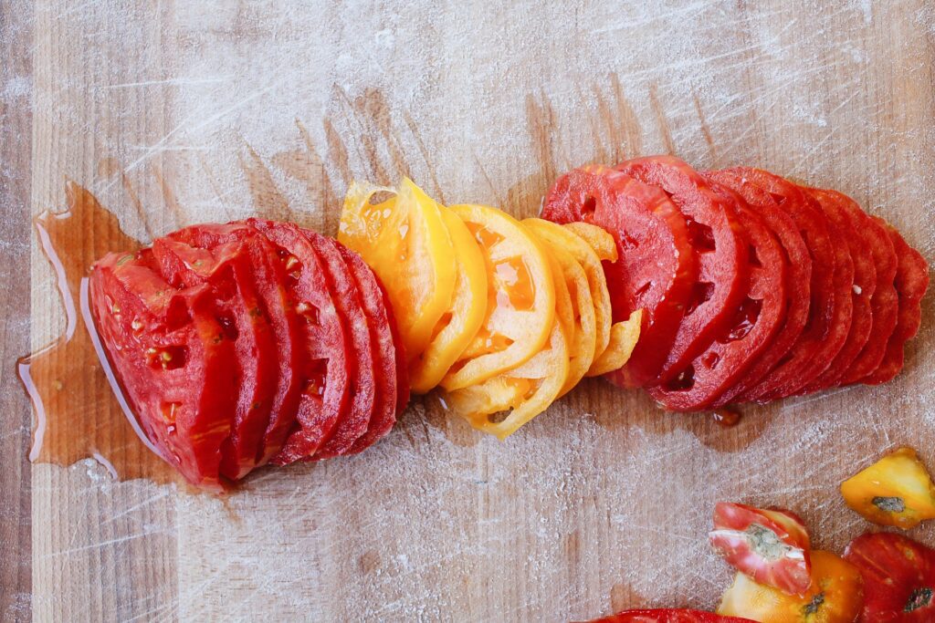 sliced heirloom tomatoes on a cutting board