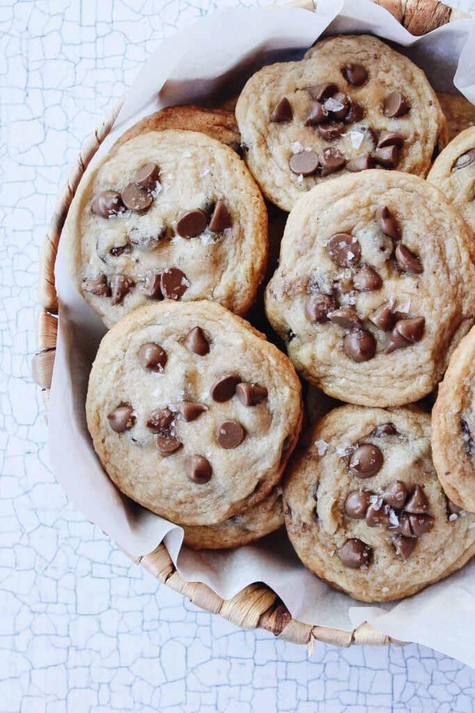 carob cookies in a basket lined with parchment