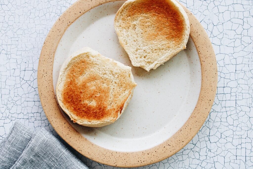 Toasted burger buns on a plate