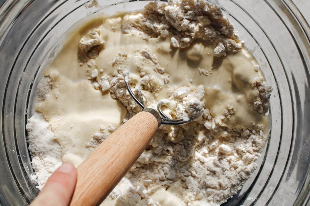 wet ingredients being whisked into dry ingredients