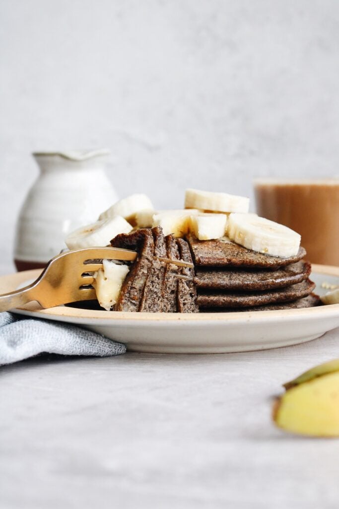 a stack of buckwheat banana pancakes on a plate