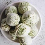 matcha truffles made with white chocolate on a white plate