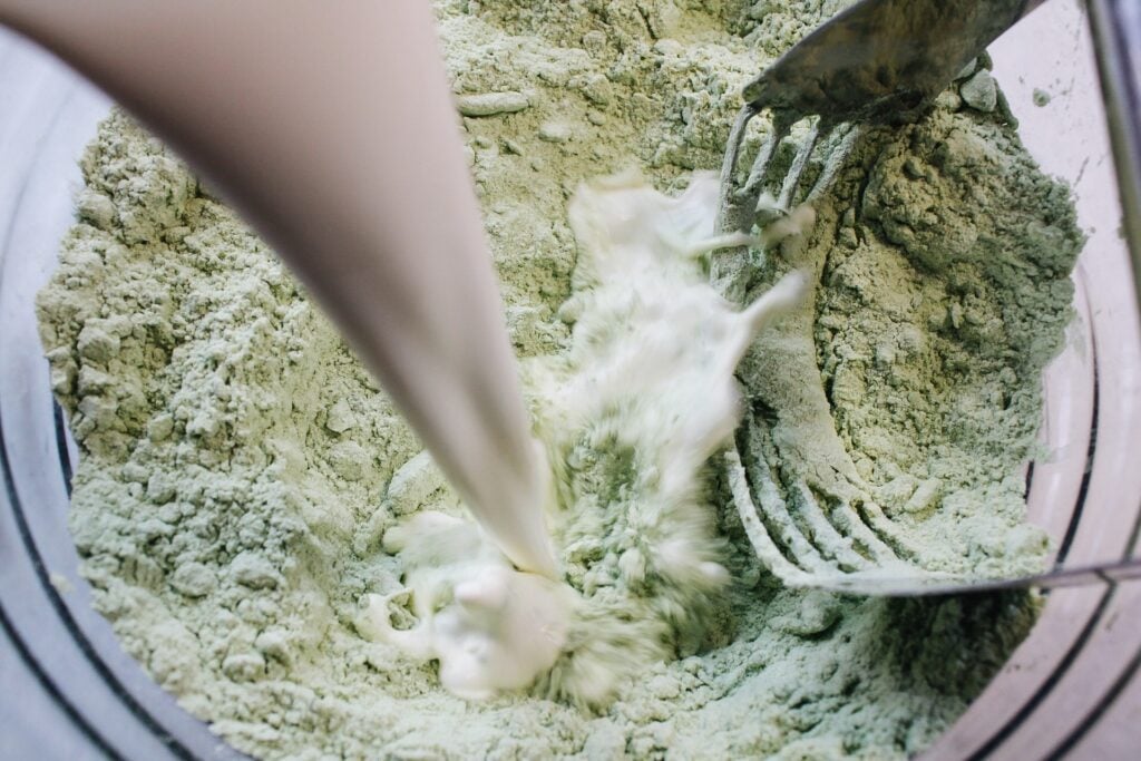 cream being added to scone dough