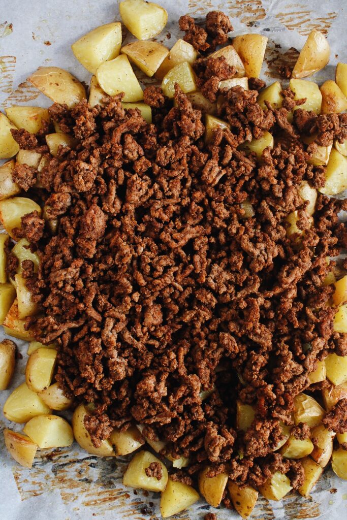 roasted potatoes topped with taco seasoned ground beef