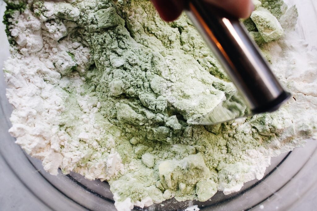 butter being incorporated into dry ingredients for matcha scone recipe